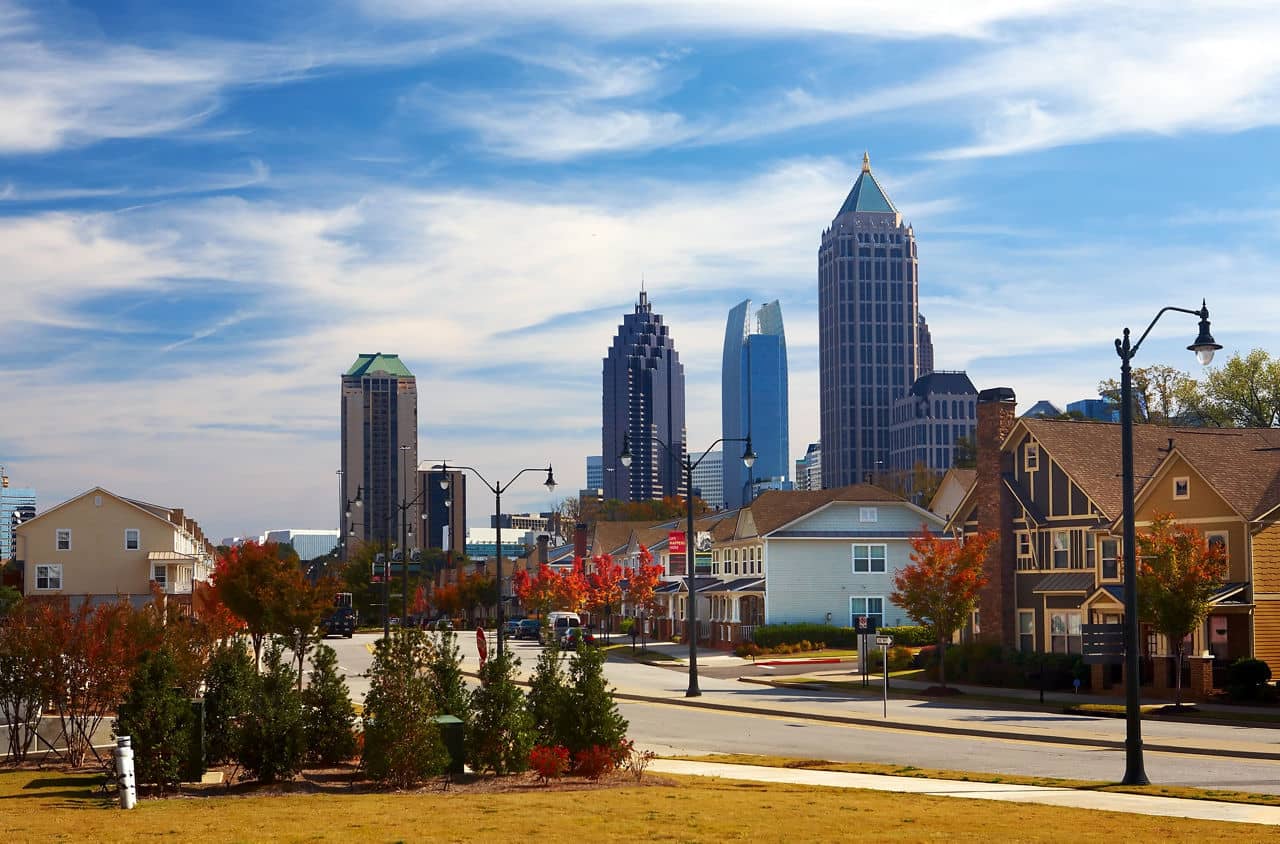 View from Blandtown/Knight Park-Howell Station, GA with residential streets, autumn trees, and the Atlanta skyline.